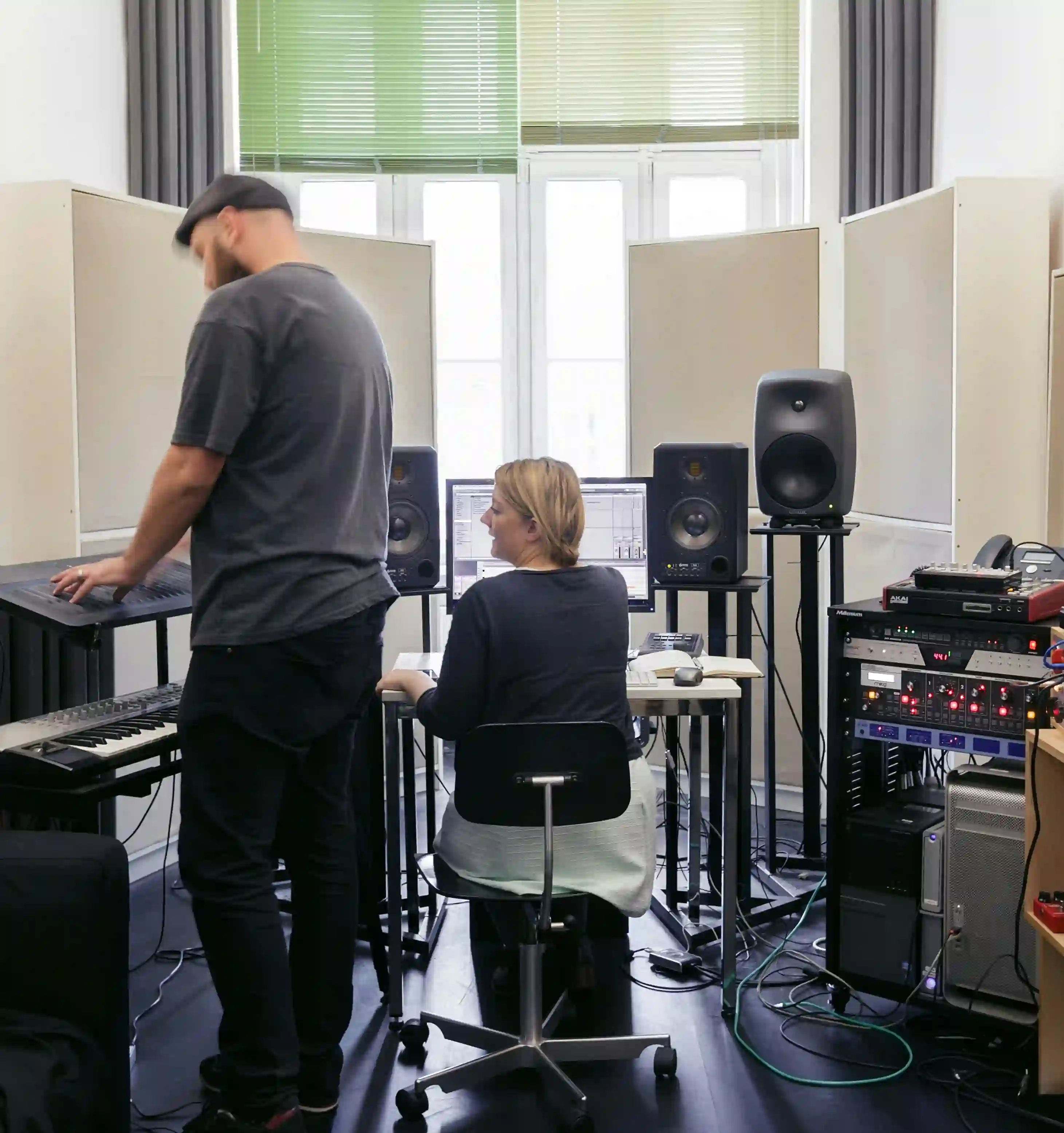 man and woman disscused in studio music